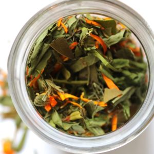 Tummy tea herbal tea blend shown in the top of the jar