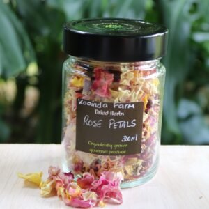 Jar of dried pink and yellow rose petals